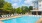 Resort-style swimming pool with lounge seating