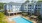Resort-style swimming pool with lounge seating