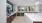 resident kitchen with large island, coffee machine and fridge