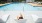 a woman tanning poolside