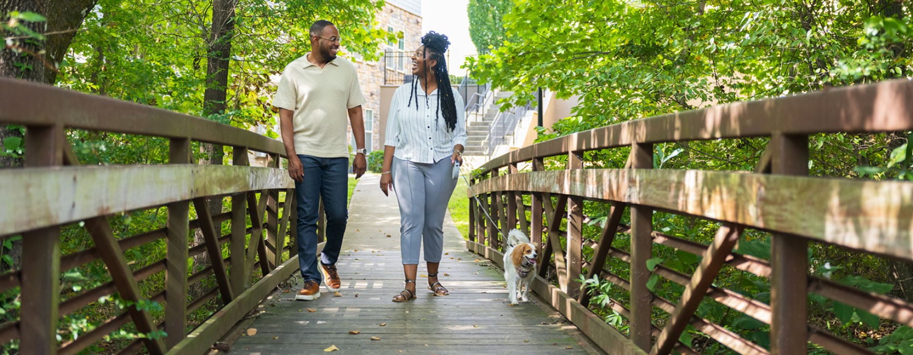 a couple walking their dog